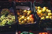 Apples and grapes in crates