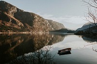 Tiny boat on still waters in Fjaerland, Norway