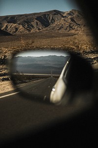 Car driving in a valley