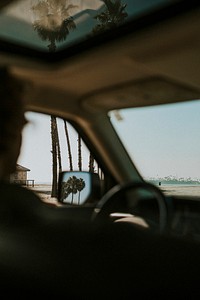 Man driving to the beach