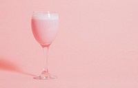 Cute pink fancy drink in a wine glass