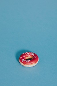 Tasty glazed donut with sprinkles