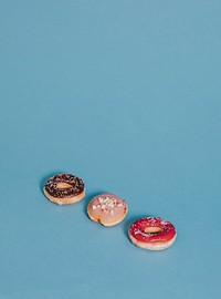 Colorful tasty glazed donut with sprinkles