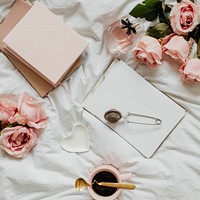 Romantic and feminine flat lay on a bed