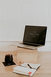Laptop mockup on a wooden table
