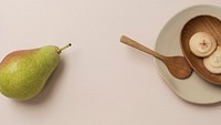 A pear and cookies on the table