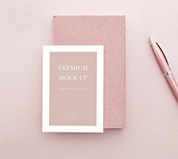 White card mockup on a pastel pink table