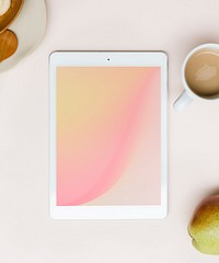Tablet mockup on a pink table flatlay