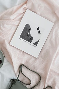 White magazine mockup on a fabric