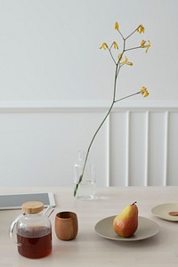 Coffee and pear on a wooden table