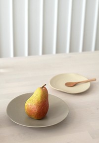 A fresh pear on a wooden table