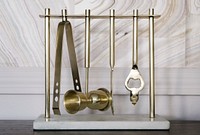 Brass kitchenware hanging on a stand