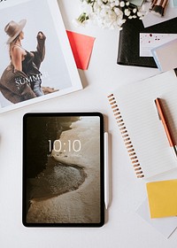 Aerial view of digital tablet on a messy table