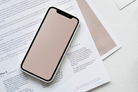 Blank smartphone screen on a paper