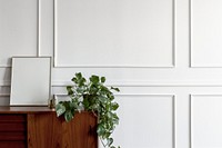 Wooden table against a white wall