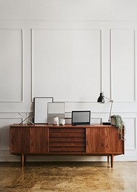 Wooden cabinet against a white wall