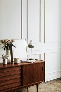 Wooden cabinet against a white wall