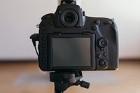 Digital camera on a tripod in a studio