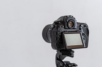 Digital camera on a tripod in a studio