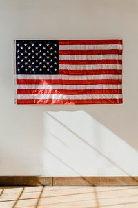 US flag on a white wall