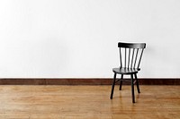 A chair against a white wall