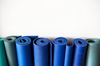 Rolls of yoga mats at a fitness center 