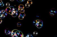 Bubbles floating in the air in the black background