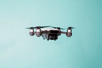 Flying drone on blue background