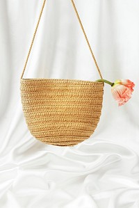 Straw woven bag mockup with a flower 
