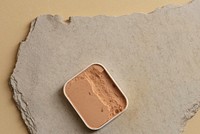 Compact face powder on a gypsum slate with copy space 