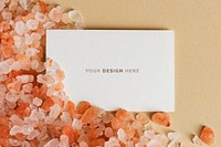 Blank white business card on orange gravel