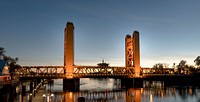 The Tower Bridge, The Tower Bridge, is a vertical lift bridge across the Sacramento River, linking West Sacramento in Yolo County to the west, with the capital of California, Sacramento, in Sacramento County to the east.
