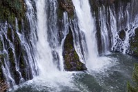 The waterfall at MacArthur-Burney Falls Memorial State Park. The park is within the Cascade Range and Modoc Plateau natural region, with forest and five miles of streamside and lake shoreline, including a portion of Lake Britton.