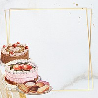 Gold frame with cakes on marble texture background