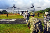 Military soldiers boarding on aircraft for mission.