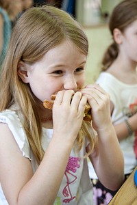A student having sandwich for lunch.