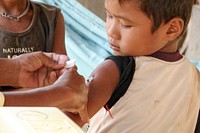 A Cambodian boy receiving his injection of measles vaccine. Original image sourced from US Government department: Public Health Image Library, <a href="https://www.rawpixel.com/search/cdc?sort=curated&amp;page=1">Centers for Disease Control and Prevention</a>. Under US law this image is copyright free, please credit the government department whenever you can&rdquo;.