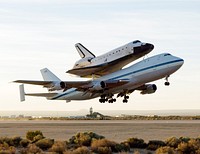 NASA&#39;s modified Boeing 747 Shuttle Carrier Aircraft with the Space Shuttle Atlantis on top lifts off from Edwards Air Force Base to begin its ferry flight back to the Kennedy Space Center in Florida. Original from NASA. Digitally enhanced by rawpixel.