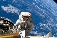 Astronaut Michael A. Lopez-Alegria pauses near the front of the International Space Station during an expedition on 8th Feb 2007. Original from NASA. Digitally enhanced by rawpixel.