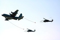 Part of the U.S. Air Force 920th Rescue Wing puts on a demonstration of in-air refueling during the World Space Expo aerial salute near the NASA Causeway at NASA's Kennedy Space Center. Original from NASA. Digitally enhanced by rawpixel.