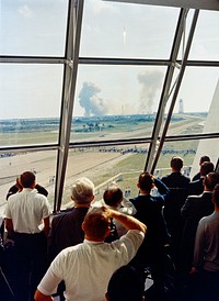 Personnel within the Launch Control Center watch the Apollo 11 liftoff from Launch Complex 39A at the start of the historic lunar landing mission. Original from NASA. Digitally enhanced by rawpixel.