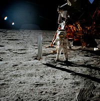 Astronaut Edwin E. Aldrin Jr., lunar module pilot, is photographed during the Apollo 11 extravehicular activity (EVA) on the lunar surface. In the right background is the lunar module. Original from NASA. Digitally enhanced by rawpixel.