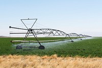 Rolling irrigation sprinkler at work along the road carrying U.S. Highways 62-180 near the New Mexico border in Hudspeth County, Texas. Original image from <a href="https://www.rawpixel.com/search/carol%20m.%20highsmith?sort=curated&amp;page=1">Carol M. Highsmith</a>&rsquo;s America, Library of Congress collection. Digitally enhanced by rawpixel.