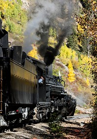 Scenic Railroad train, pulled by a vintage steam locomotive, chugs through the San Juan Mountains in the Colorado county of the same name. Original image from <a href="https://www.rawpixel.com/search/carol%20m.%20highsmith?sort=curated&amp;page=1">Carol M. Highsmith</a>&rsquo;s America, Library of Congress collection. Digitally enhanced by rawpixel.