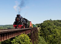 A steam train on a heritage railroad that operates excursions in Boone County, Iowa, crosses the 156-foot-tall Bass Point Creek Bridge. Original image from Carol M. Highsmith&rsquo;s America, Library of Congress collection. Digitally enhanced by rawpixel.