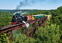 A steam train crosses the 156-foot-tall Bass Point Creek Bridge. Original image from <a href="https://www.rawpixel.com/search/carol%20m.%20highsmith?sort=curated&amp;page=1">Carol M. Highsmith</a>&rsquo;s America, Library of Congress collection. Digitally enhanced by rawpixel.