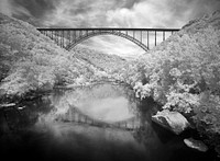 Infrared-camera view of the New River Gorge Bridge in Fayette County, West Virginia. Original image from <a href="https://www.rawpixel.com/search/carol%20m.%20highsmith?sort=curated&amp;page=1">Carol M. Highsmith</a>&rsquo;s America, Library of Congress collection. Digitally enhanced by rawpixel.