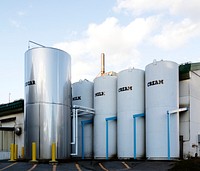 Silo-sized containers of ice cream ingredients at the Ben and Jerry&#39;s Ice Cream Factory in South Burlington, Vermont. Original image from <a href="https://www.rawpixel.com/search/carol%20m.%20highsmith?sort=curated&amp;page=1">Carol M. Highsmith</a>&rsquo;s America, Library of Congress collection. Digitally enhanced by rawpixel.