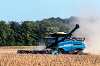 A harvester kicks up dust in a cornfield near Bridgeton in Parke County, Indiana. Original image from <a href="https://www.rawpixel.com/search/carol%20m.%20highsmith?sort=curated&amp;page=1">Carol M. Highsmith</a>&rsquo;s America, Library of Congress collection. Digitally enhanced by rawpixel.