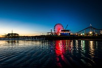 The Santa Monica pier at sunset. Original image from <a href="https://www.rawpixel.com/search/carol%20m.%20highsmith?sort=curated&amp;page=1">Carol M. Highsmith</a>&rsquo;s America, Library of Congress collection. Digitally enhanced by rawpixel.